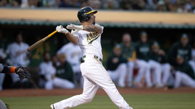 Oakland Athletics infielder Jace Peterson (6) hits a two-run single against the Houston Astros at Oakland Alameda-County Coliseum.